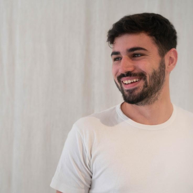 Aria Chen, Lead Design Curator at HarborNotchAmber, reviewing corporate floral arrangements